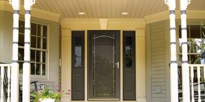 Brown entry door and porch